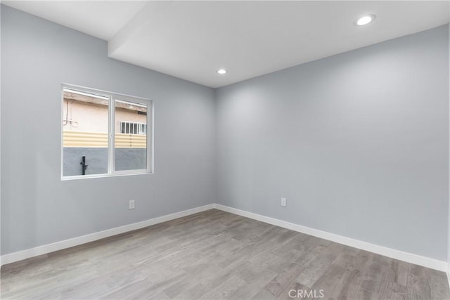 7321 Eglise Ave, Pico Rivera, CA 90660 - spare room with light wood-type flooring, baseboards, and recessed lighting