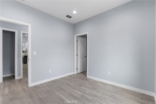 7321 Eglise Ave, Pico Rivera, CA 90660 - empty room featuring light wood-style floors and baseboards