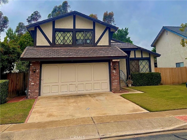 21081 Paseo Verdura, Lake Forest, CA 92630 - tudor-style house featuring brick siding, an attached garage, driveway, and stucco siding