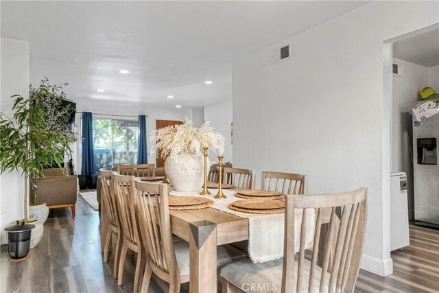 9414 Moonbeam Ave Unit 18, Panorama City, CA 91402 - dining area with wood finished floors and recessed lighting