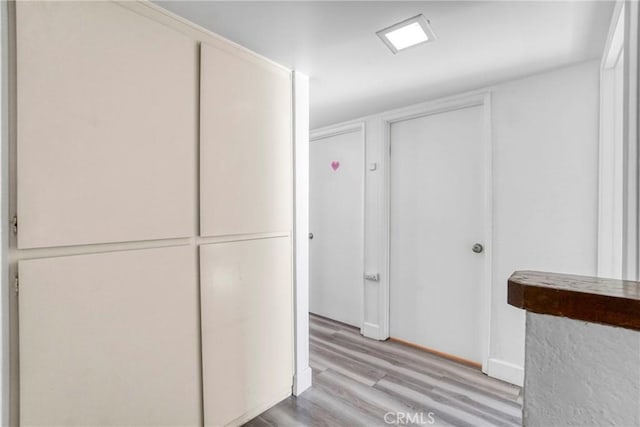 9414 Moonbeam Ave Unit 18, Panorama City, CA 91402 - hall featuring light wood finished floors and baseboards
