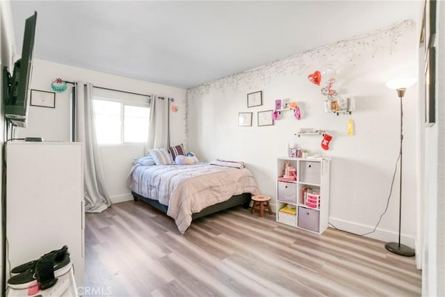9414 Moonbeam Ave Unit 18, Panorama City, CA 91402 - bedroom featuring light wood finished floors and baseboards