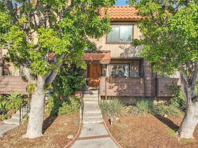 9414 Moonbeam Ave Unit 18, Panorama City, CA 91402 - view of front of house with stairway and a tiled roof