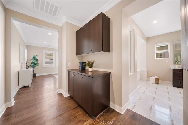 74 Gainsboro, Irvine, CA 92620 - hallway with ornamental molding, wood finished floors, baseboards, and recessed lighting