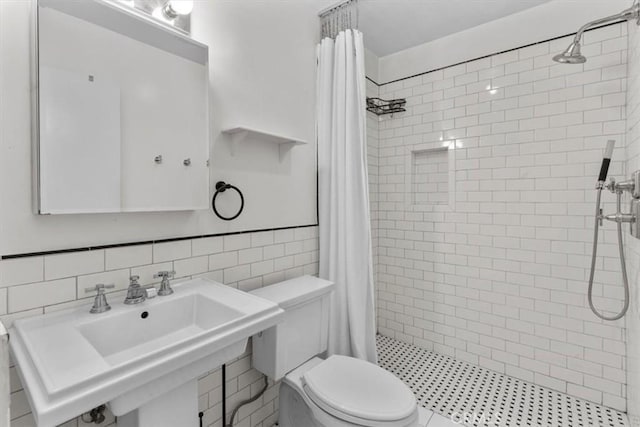 525 N Sycamore Unit 320, Los Angeles, CA 90036 - full bath featuring toilet, a tile shower, tile walls, and a sink
