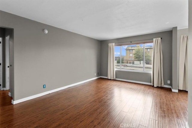 525 N Sycamore Unit 320, Los Angeles, CA 90036 - empty room featuring dark wood-style flooring and baseboards
