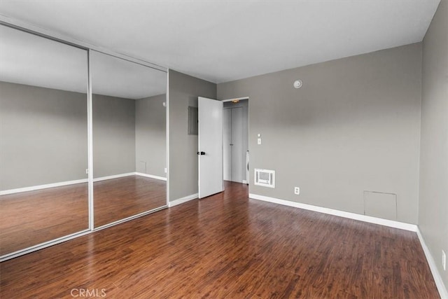 525 N Sycamore Unit 320, Los Angeles, CA 90036 - unfurnished bedroom with baseboards, wood finished floors, and a closet