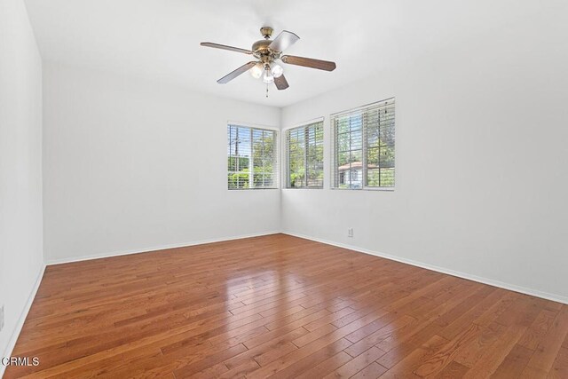 260262 Acacia St, Altadena, CA 91001 - empty room with ceiling fan, wood-type flooring, and baseboards