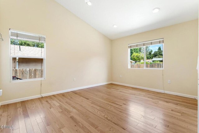 260262 Acacia St, Altadena, CA 91001 - spare room featuring light wood-type flooring, lofted ceiling, and baseboards