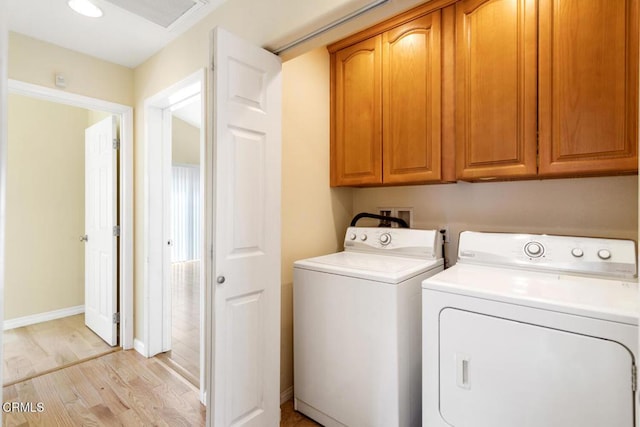 260262 Acacia St, Altadena, CA 91001 - washroom featuring cabinet space, washer and dryer, light wood finished floors, and baseboards