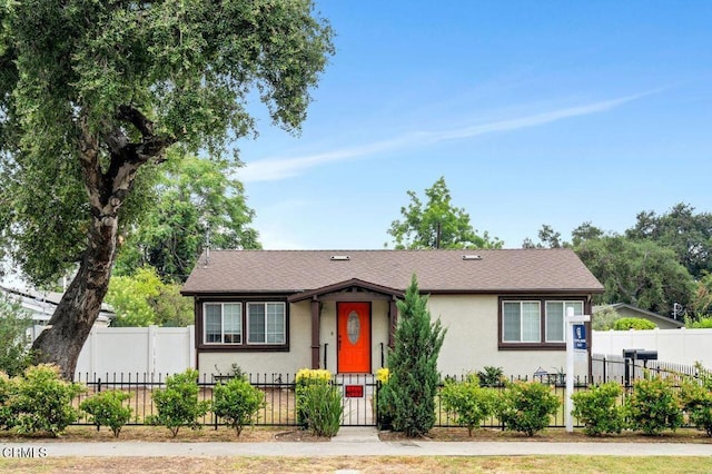 260262 Acacia St, Altadena, CA 91001 - view of front facade featuring stucco siding and a fenced front yard