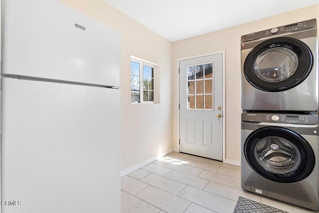 260262 Acacia St, Altadena, CA 91001 - laundry room featuring stacked washer / dryer, baseboards, and light tile patterned flooring
