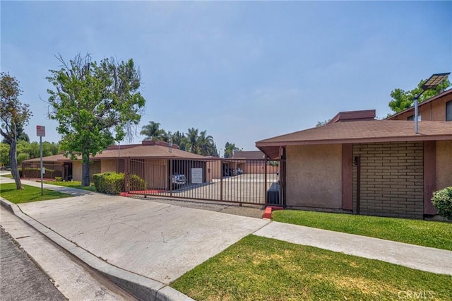5905 Rosemead Blvd Unit 16, Pico Rivera, CA 90660 - view of front of home with stucco siding and a gate