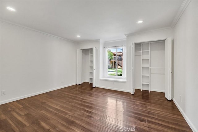 5905 Rosemead Blvd Unit 16, Pico Rivera, CA 90660 - unfurnished bedroom featuring two closets, crown molding, dark wood-style floors, baseboards, and recessed lighting