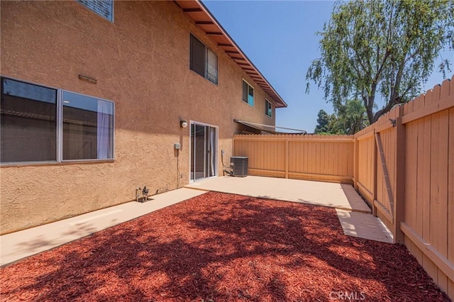5905 Rosemead Blvd Unit 16, Pico Rivera, CA 90660 - fenced backyard with a patio area and central AC