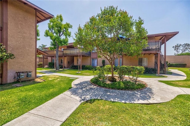 5905 Rosemead Blvd Unit 16, Pico Rivera, CA 90660 - view of home's community featuring stairs, a lawn, and a wooden deck