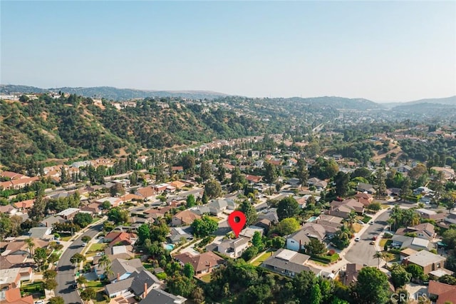 22443 Robin Oaks, Diamond Bar, CA 91765 - aerial overview of property's location with nearby suburban area and a mountainous background