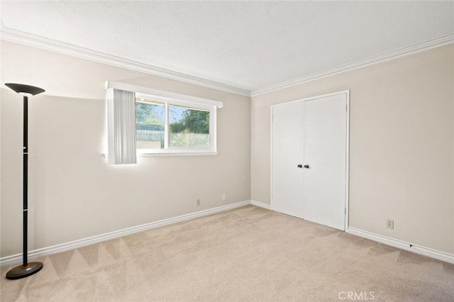 22443 Robin Oaks, Diamond Bar, CA 91765 - unfurnished bedroom with light colored carpet, crown molding, baseboards, and a closet