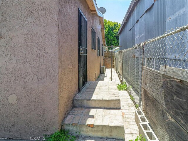 119 W 61st St, Los Angeles, CA 90003 - view of side of home featuring stucco siding