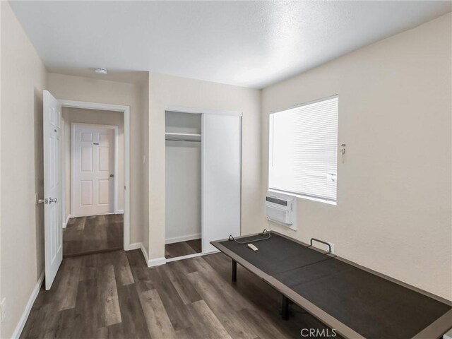 119 W 61st St, Los Angeles, CA 90003 - exercise area featuring dark wood finished floors and baseboards