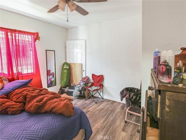 119 W 61st St, Los Angeles, CA 90003 - bedroom with wood finished floors and ceiling fan