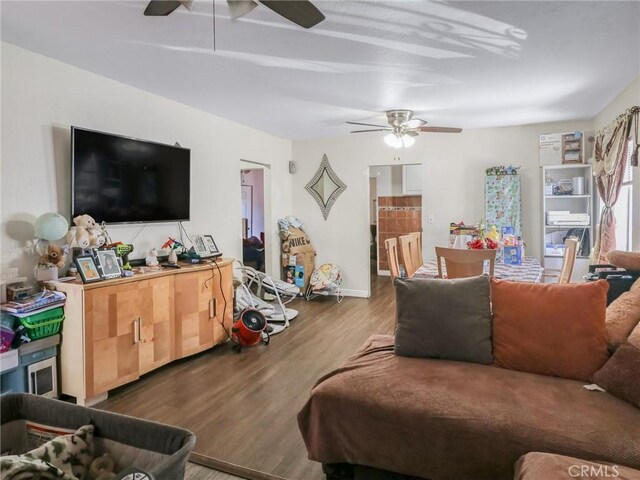 119 W 61st St, Los Angeles, CA 90003 - living area with ceiling fan, wood finished floors, and baseboards
