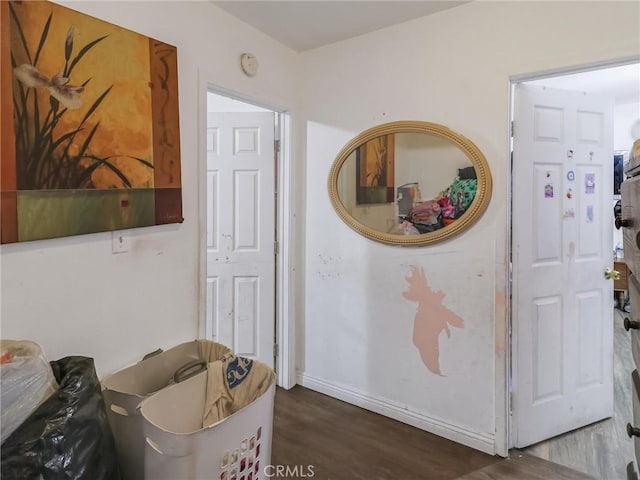 119 W 61st St, Los Angeles, CA 90003 - hallway with wood finished floors and baseboards