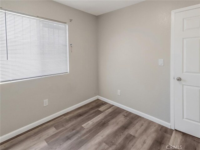 119 W 61st St, Los Angeles, CA 90003 - unfurnished room featuring wood finished floors and baseboards