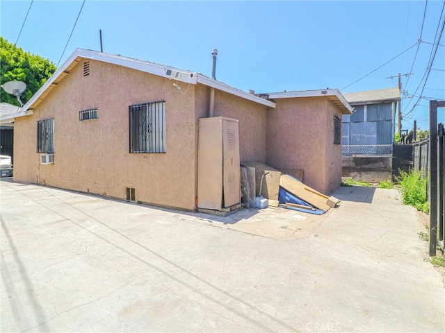 119 W 61st St, Los Angeles, CA 90003 - rear view of property with stucco siding