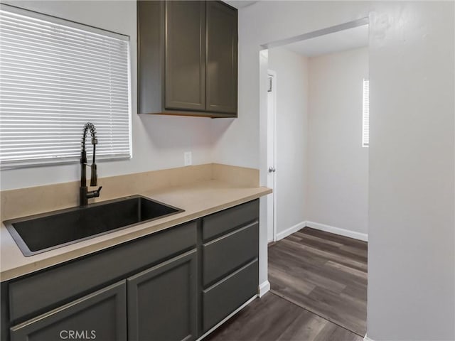 119 W 61st St, Los Angeles, CA 90003 - kitchen featuring a sink, gray cabinetry, and dark wood-style flooring