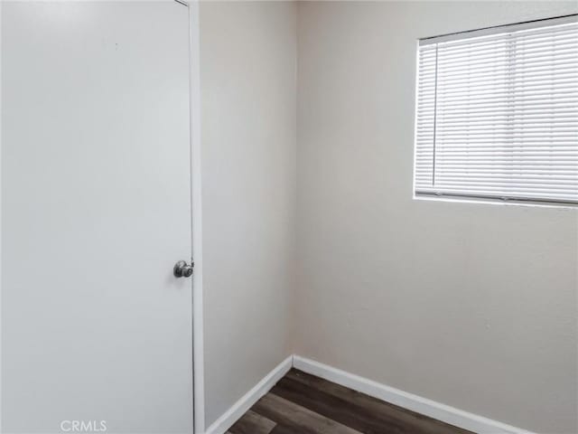 119 W 61st St, Los Angeles, CA 90003 - spare room with baseboards and dark wood-style floors