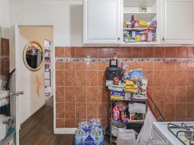 119 W 61st St, Los Angeles, CA 90003 - kitchen featuring dark wood-style floors, white cabinets, tile walls, and range