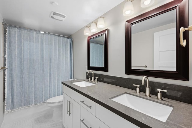 867 Wilbur Ave, San Diego, CA 92109 - full bath with double vanity, toilet, tile patterned floors, and shower / tub combo