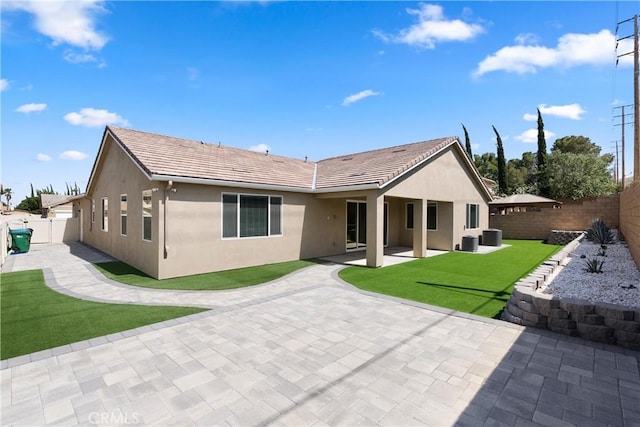 41719 Wayladn Ct, Lancaster, CA 93536 - back of house with stucco siding, a patio, and a tiled roof