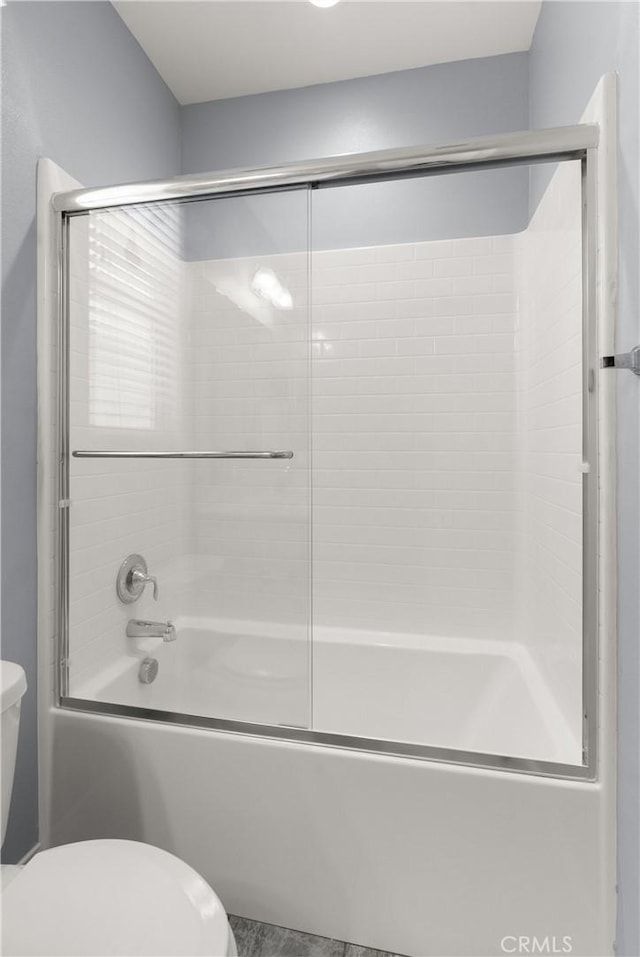 41719 Wayladn Ct, Lancaster, CA 93536 - bathroom featuring toilet and shower / bath combination with glass door