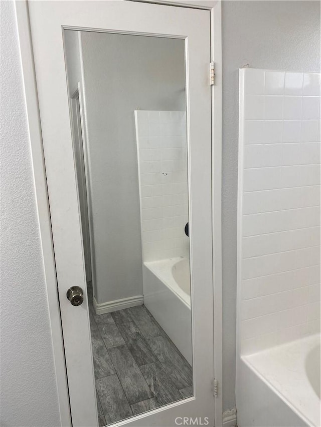 28227 Cobbler Ct, Menifee, CA 92585 - full bath featuring wood finished floors, shower / washtub combination, and baseboards