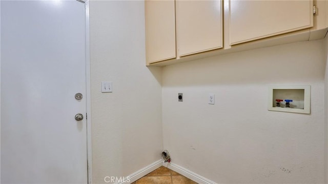 22820 Lark St, Grand Terrace, CA 92313 - laundry area featuring cabinet space, baseboards, hookup for an electric dryer, hookup for a washing machine, and tile patterned floors