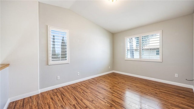 22820 Lark St, Grand Terrace, CA 92313 - spare room with vaulted ceiling, wood finished floors, and baseboards