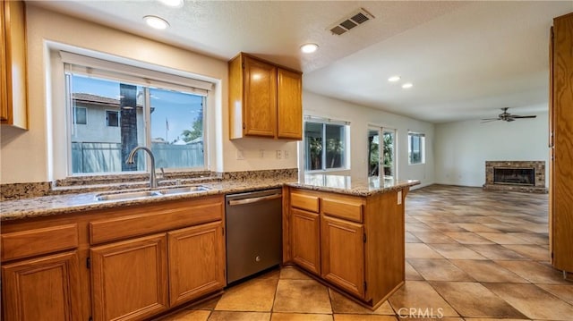 22820 Lark St, Grand Terrace, CA 92313 - kitchen with dishwasher, a sink, a peninsula, brown cabinetry, and recessed lighting