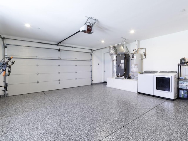 6197 Mandarin Rd, Yucca Valley, CA 92284 - garage featuring secured water heater, independent washer and dryer, a garage door opener, heating unit, and recessed lighting