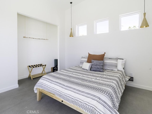 6197 Mandarin Rd, Yucca Valley, CA 92284 - carpeted bedroom with multiple windows and baseboards