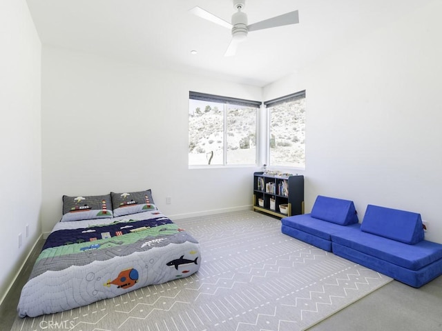 6197 Mandarin Rd, Yucca Valley, CA 92284 - bedroom with carpet floors, baseboards, and a ceiling fan