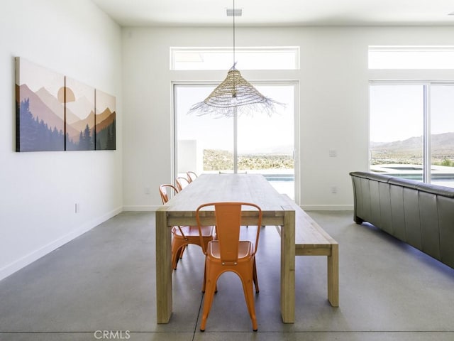 6197 Mandarin Rd, Yucca Valley, CA 92284 - dining area with baseboards, plenty of natural light, and a mountain view