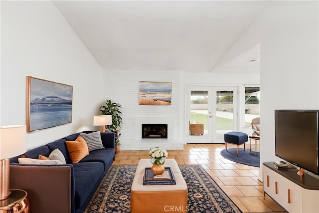 10709 Calabash Ave, Fontana, CA 92337 - living room featuring vaulted ceiling, french doors, light tile patterned floors, and a brick fireplace