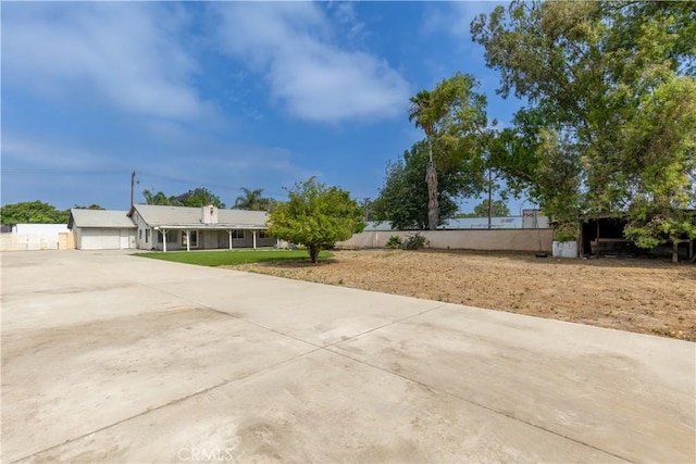 10709 Calabash Ave, Fontana, CA 92337 - view of front of house featuring a porch and concrete driveway