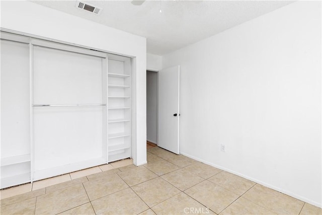 10709 Calabash Ave, Fontana, CA 92337 - unfurnished bedroom with a closet, light tile patterned flooring, a ceiling fan, and baseboards