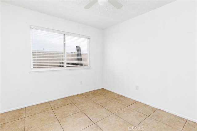 10709 Calabash Ave, Fontana, CA 92337 - spare room with a ceiling fan, baseboards, a textured ceiling, and light tile patterned floors