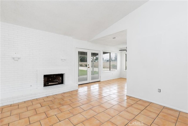 10709 Calabash Ave, Fontana, CA 92337 - unfurnished living room featuring lofted ceiling, a brick fireplace, french doors, and tile patterned flooring
