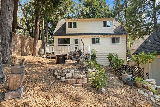 186 Hemlock Dr, Lake Arrowhead, CA 92352 - rear view of property featuring an outdoor fire pit and a shingled roof