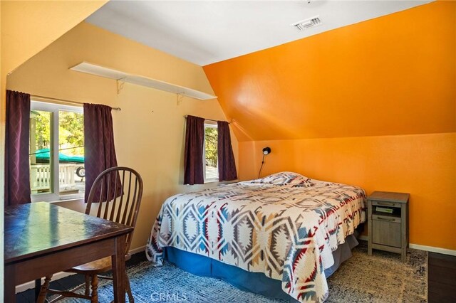 186 Hemlock Dr, Lake Arrowhead, CA 92352 - bedroom with vaulted ceiling, baseboards, wood finished floors, and access to exterior